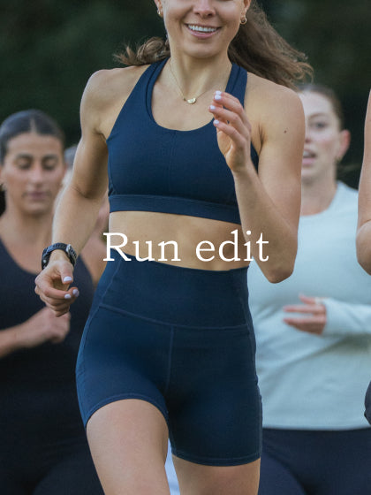 Model running wearing cropped shorts and tank in black