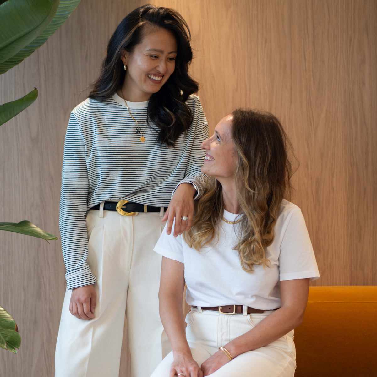 Two women in studio wearing Nimble activewear smiling together